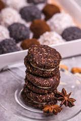 Round brown biscuits on the table. Cookies with nuts, cinnamon, coconut. candies.