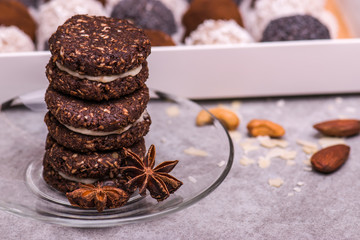 Round brown biscuits on the table. Cookies with nuts, cinnamon, coconut. candies.