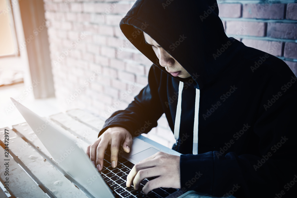 Poster computer hacker trying to accessing privacy financial information on his laptop, cyber anonymous man