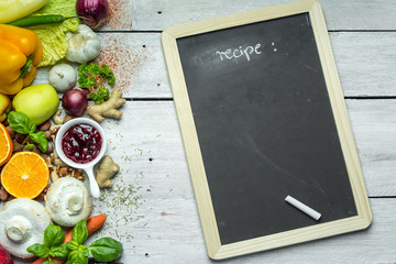 blackboard, chalk and lots of fruits, vegetables and herbs, a place to write your own menu or recipe