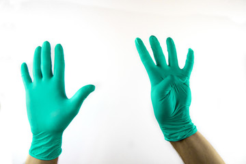 Male hand in medical glove on white background.
