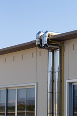 Fototapeta na wymiar metal pipes on modern building