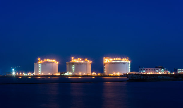 A large oil-refinery plant with Liquefied Natural Gas (LNG) storage tanks