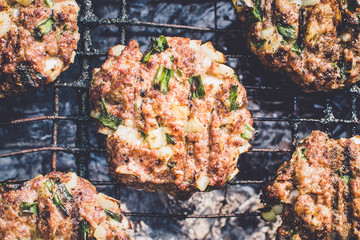 frying cutlets for burgers on the grill