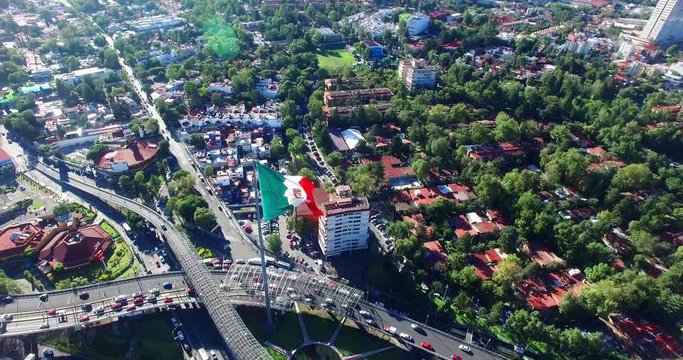 Aerial view of a huge mexican flag fluttering, Mexico City. TK1