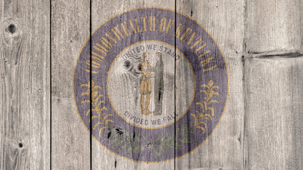 USA Politics News Concept: US State Kentucky Seal Wooden Fence Background