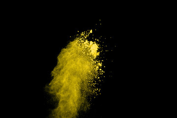 Fototapeta na wymiar Gold powder particles explosion. Glitter burst with golden texture. Yellow color dust splash for fashion background.