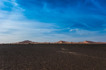 Fototapeta na wymiar View of Merzouga dunes and black desert, southern Morocco