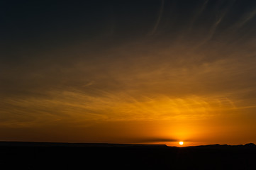 sunrise of black desert near Merzouga, Morocco