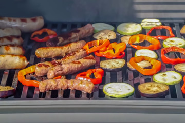 Abstract, blur, bokeh background, defocusing - image for the background. Eat sausages and grilled vegetables