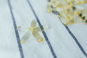 Top view omega 3 capsules from Fish Oil on kitchen towel