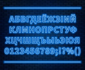 Neon Cyrillic alphabet with numbers on the brick wall background. Can be used for Belarusian and Ukrainian languages.