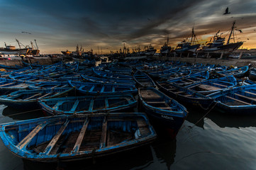 Fototapeta na wymiar Blue boats in the port of Essaouira, Morocco