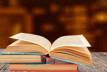 open book on a group of books