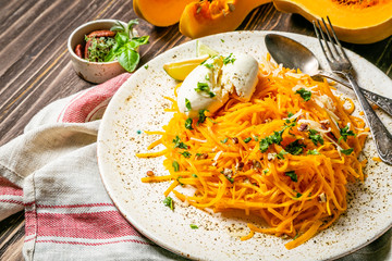 Butternut squash noodles with mozzarela, pecans, herbs, copy space