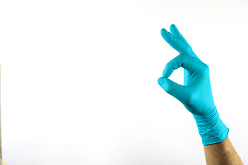 Male hand in medical glove on white background.