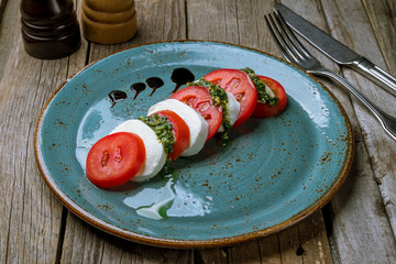 Caprese salad with mozzarella and tomato