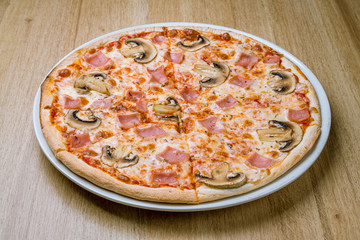 Pizza with ham and mushrooms