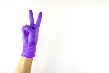 Male hand in medical glove on white background.