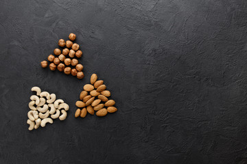 Nuts - hazelnut, almond, cashew. Top view with copy space.