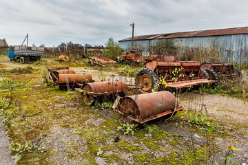 Old agricultural machinery. .Abandoned collective farm. Russia, Tula region.