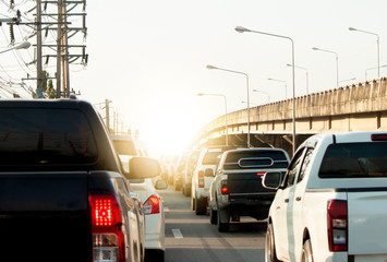 Obraz premium Cars on the road in traffic junction with Bridge cross on beside.