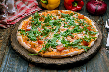 Pizza with arugula and shrimp