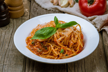 Spaghetti with vegetables in tomato sauce
