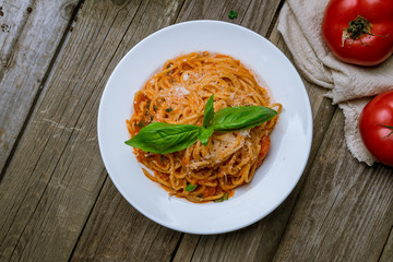 Spaghetti with vegetables in tomato sauce