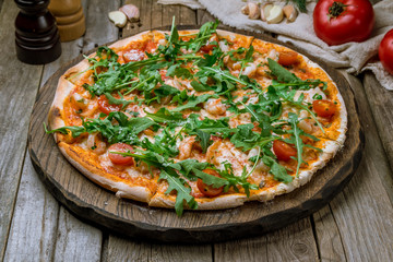 Pizza with arugula and shrimp