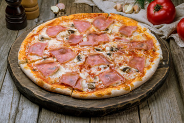 Pizza with ham and mushrooms