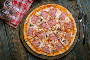 Pizza with ham and mushrooms