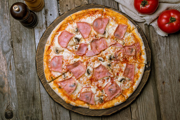 Pizza with ham and mushrooms