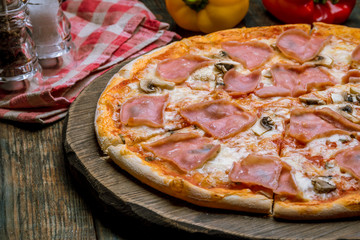 Pizza with ham and mushrooms