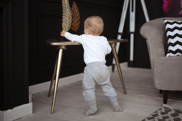 Baby 10 months in real interior, first steps