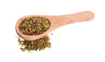 dry oregano leaves on bamboo spoon and on white background