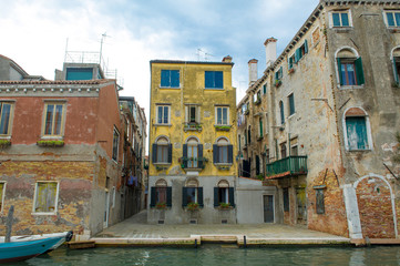Fototapeta na wymiar old venetian house and canal in Venice , Italy