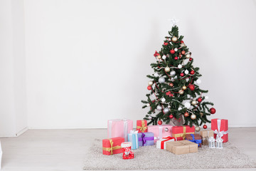 Christmas tree with presents on a white background for the new year