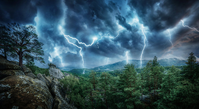 Lightning thunderstorm flash in the mountains. Concept on topic weather, cataclysms (hurricane, Typhoon, tornado, storm)