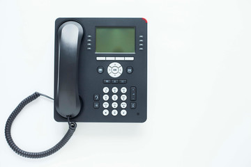 Deskphone, office and business concept. New ip phone with buttons and big display for communication without interference. Top view. Space for a text. Close up.