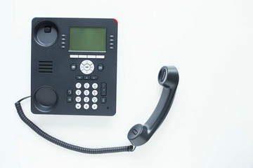 Deskphone, office and business concept. New ip phone with buttons and big display for communication without interference. Top view. Space for a text. Close up.