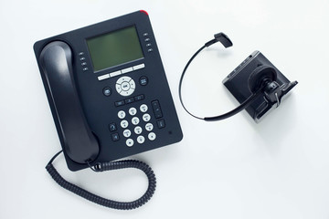 Deskphone, office and business concept. New ip phone with buttons and big display for communication without interference. Top view. Space for a text. Close up.