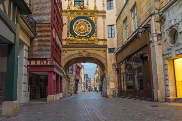 Fototapeta na wymiar old cozy street in Rouen with famos Great clocks or Gros Horloge of Rouen, Normandy, France