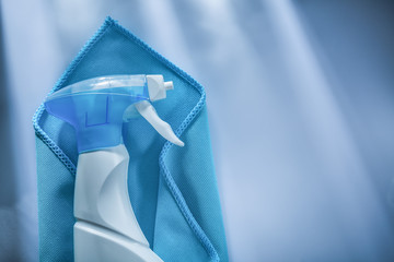Blue washing rag sprayer on white surface