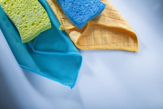 Cleaning household washcloth sponges on white background