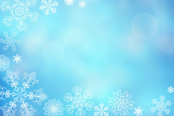 Christmas abstract winter shiny snow bokeh background with unique snowflakes