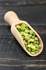 Dry green peas in scoop