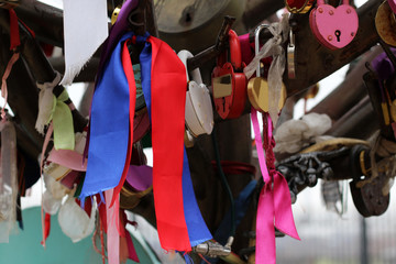 Wedding ribbons and locks on a metal tree