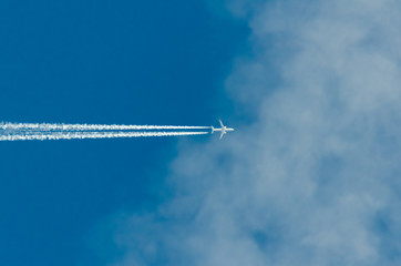 Plane flying into the clouds