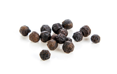 black pepper corns on white background